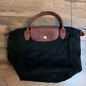 Long champ small top handle bag